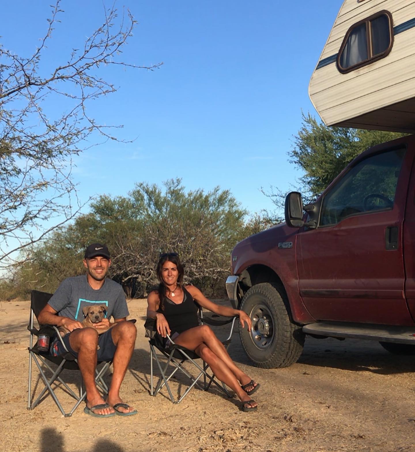 BajaRoam founders and their dog beside their former camper in Santiago, Baja California Sur